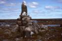 Inuksuk carrying a message (indicated by the white stones) in the Arviat area, Keewatin, 1990
…