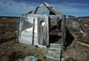 Remains of a winter tent frame, with a porthole "window" from the Nascopie. 
Igalaalik, Southw…