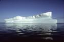 Icebergs out to sea from Kinngait (Cape Dorset). 
Southwest Baffin Island, Nunavut, 1992

Th…