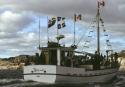 Boats from Arctic Quebec arriving in the Dorset harbour for a celebration of feasting and music…